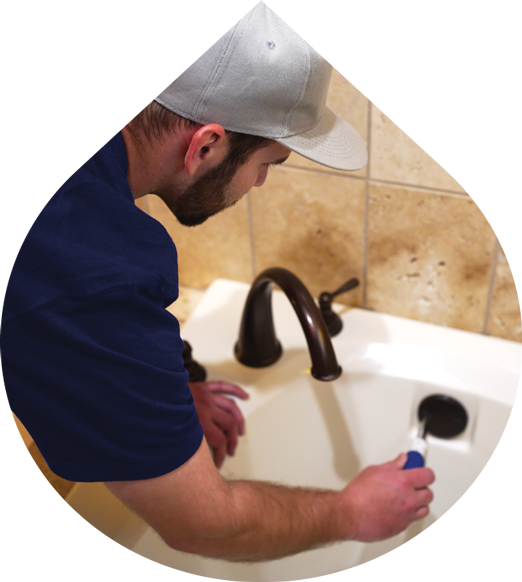 Plumber fixing a bathtub