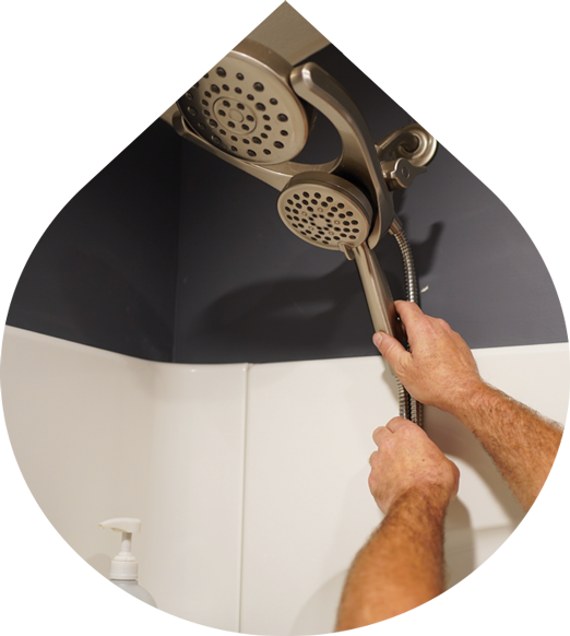 Man fixing a shower head