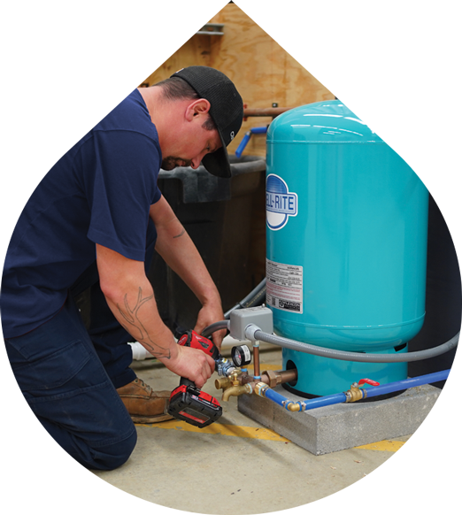 Plumber fixing a well pump