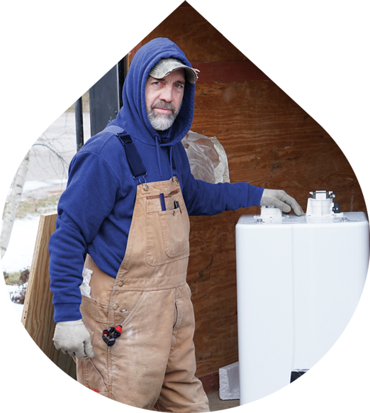gahanna-plumbing-drain-winterization Plumber in front of a Tankless Water Heater